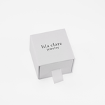 white ring box with lila clare logo