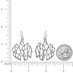 silver cactus earrings on white with ruler for size